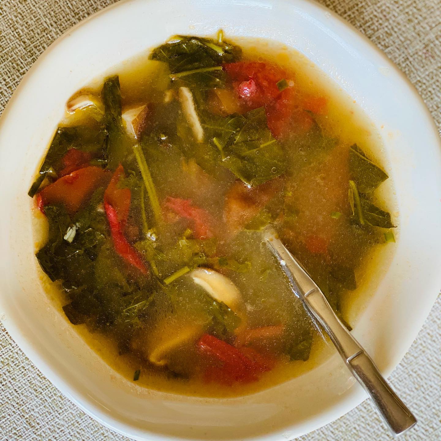 shiitake mushroom soup with greens and tomato