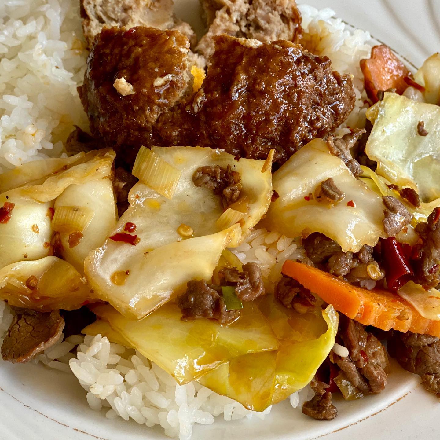 Shanghai giant meatball with spicy pickled cabbage on rice